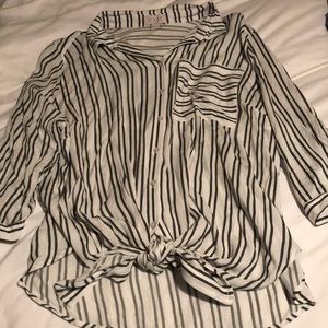 Long sleeved blouse with knot tie bottom.